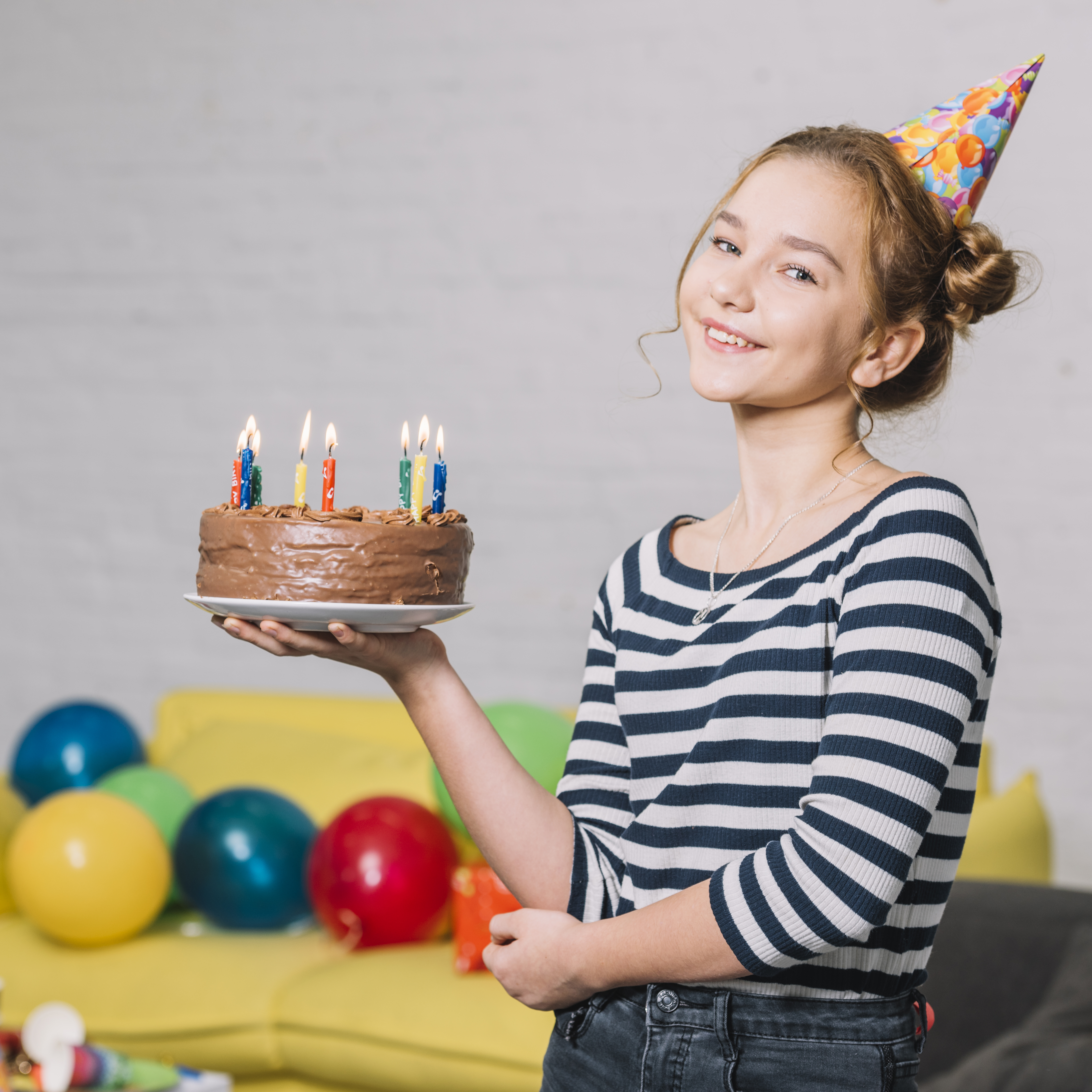 portrait-happy-girl-holding-delicious-cake-white-plate-party